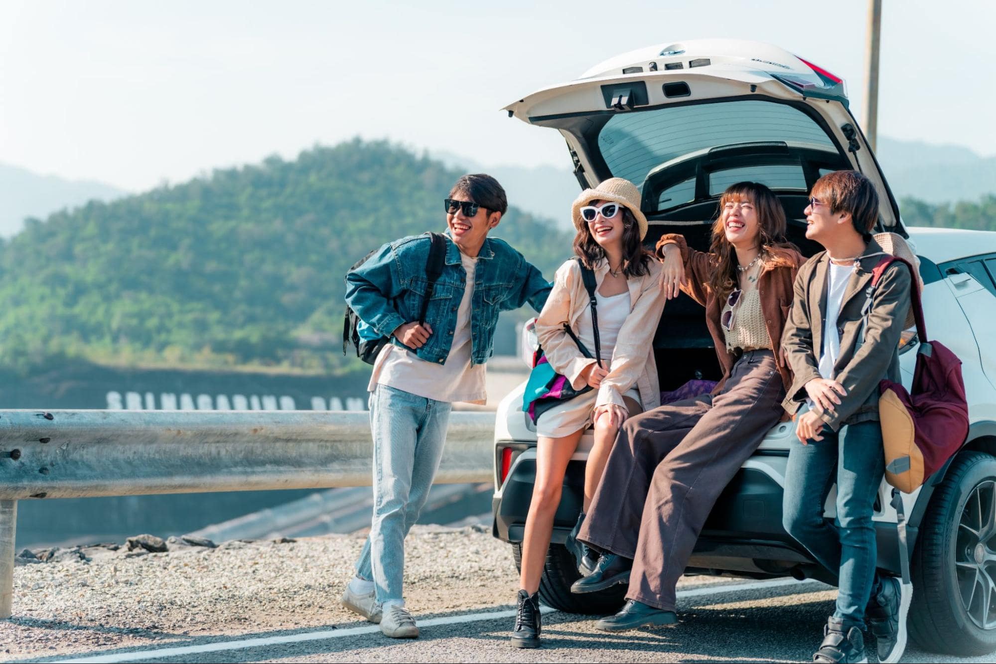 Road Trip Essentials - Group Sitting in the Back of an SUV