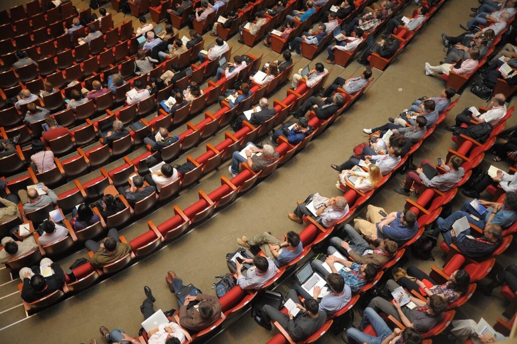 Tips for Becoming A Successful Motivational Speaker - crowd in auditorium listening