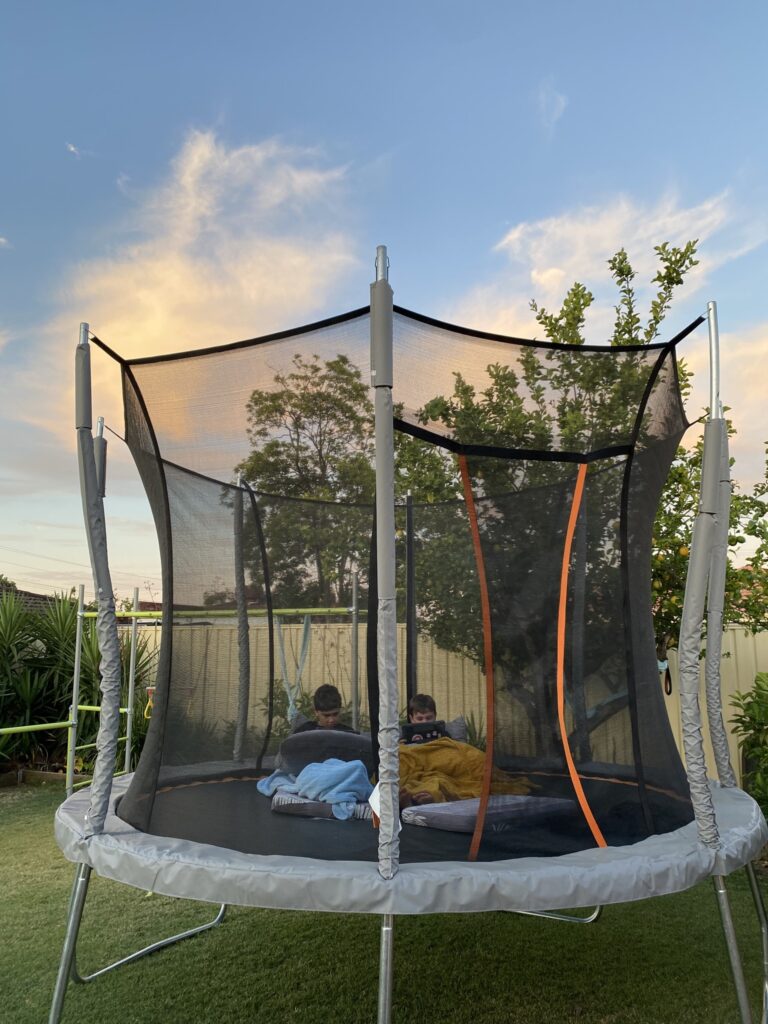 Trampoline Safety Tips - Kids in Sleeping Bags Reading