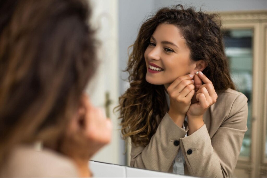 Seasonal Transitions - Girl Putting on Earring