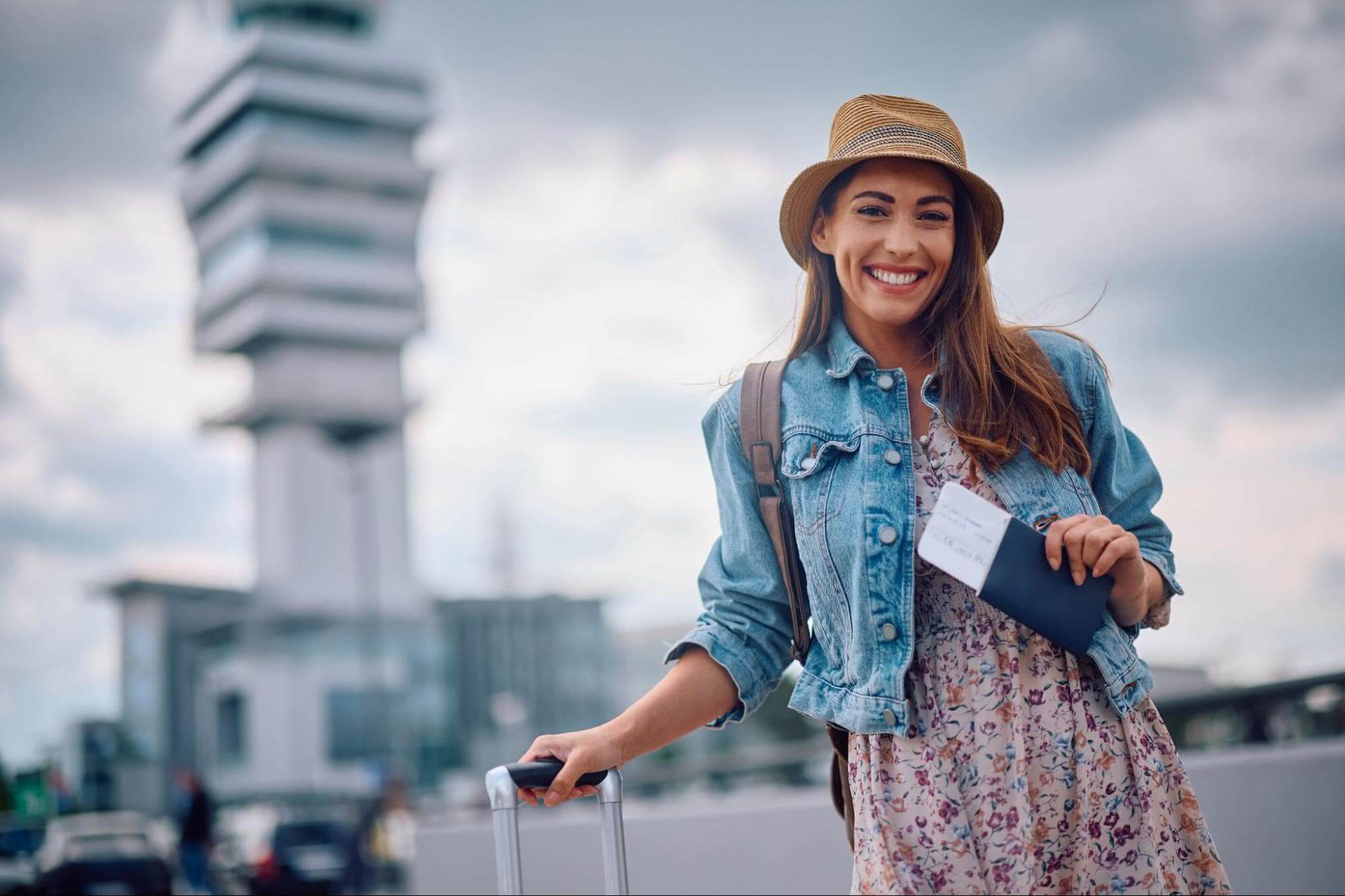 How to Travel Smart - Woman Standing with Suitcase